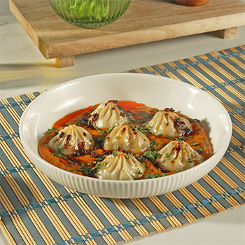 A butter chicken dumplings recipe made with Lee Kum Kee sauces.