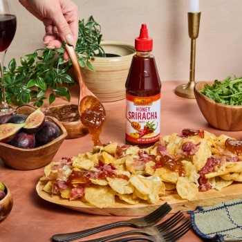 Charcuterie chips recipe on a tray made with a fig jam recipe featuring Lee Kum Kee Honey Sriracha