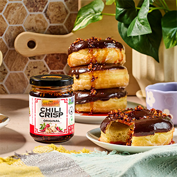 A chocolate donut recipe with a chili crisp topping.