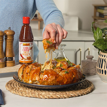 A pull apart bread recipe with crab rangoon flavors.