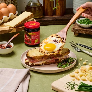 A croque madame recipe topped with a Lee Kum Kee chili crisp egg.