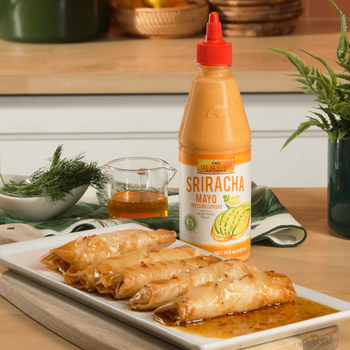 Five feta rolls with hot honey sauce and Lee Kum Kee Sriracha Mayo, made from a delicious feta rolls recipe.