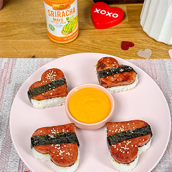 A plate of heart-shaped spam musubi made for Valentine's Day.