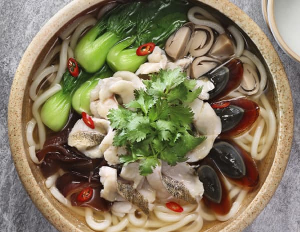 Udon in Soup with Cilantro Preserved Egg Sliced Fish and Black Fungus