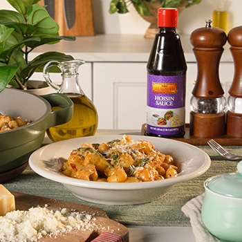 A chicken gnocchi recipe made in a skillet and finished with Lee Kum Kee Hoisin Sauce.