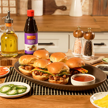 A lemongrass chicken sliders recipe with Vietnamese style lemongrass chicken, pickled veggies, and Lee Kum Kee Hoisin and Sriracha for dipping.