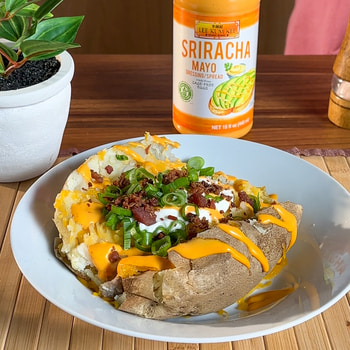 A loaded baked potato recipe made in the microwave with Lee Kum Kee Sriracha Mayo.