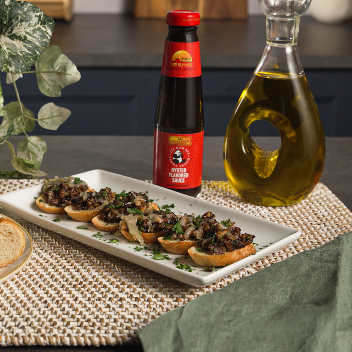 A mushroom and gruyere mini toast bites recipe featuring Lee Kum Kee Panda Brand Oyster Sauce.