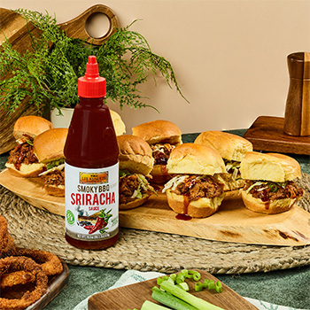 A pulled pork sliders recipe made in the slow cooker and infused with spicy smoky bbq sauce.
