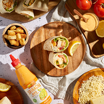  A Spicy Chicken Caesar Wrap surrounded by ingredients