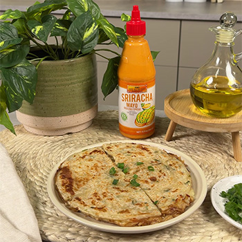 A scallion pancake quesadilla recipe with enoki mushrooms and a sriracha mayo dip.