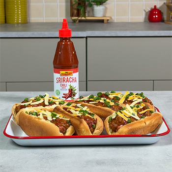 A chili cheese dogs recipe with a spicy kick of Sriracha Chili sauce.