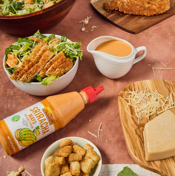 A spicy crispy chicken caesar salad recipe made with Lee Kum Kee Sriracha sauces. 
