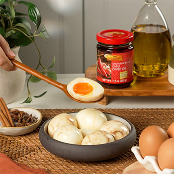 A spicy tea eggs recipe for a spicy twist on soy marinated eggs made with chili crisp oil.