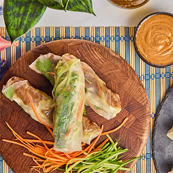 Vietnamese Spring Rolls served with a hoisin peanut dipping sauce.